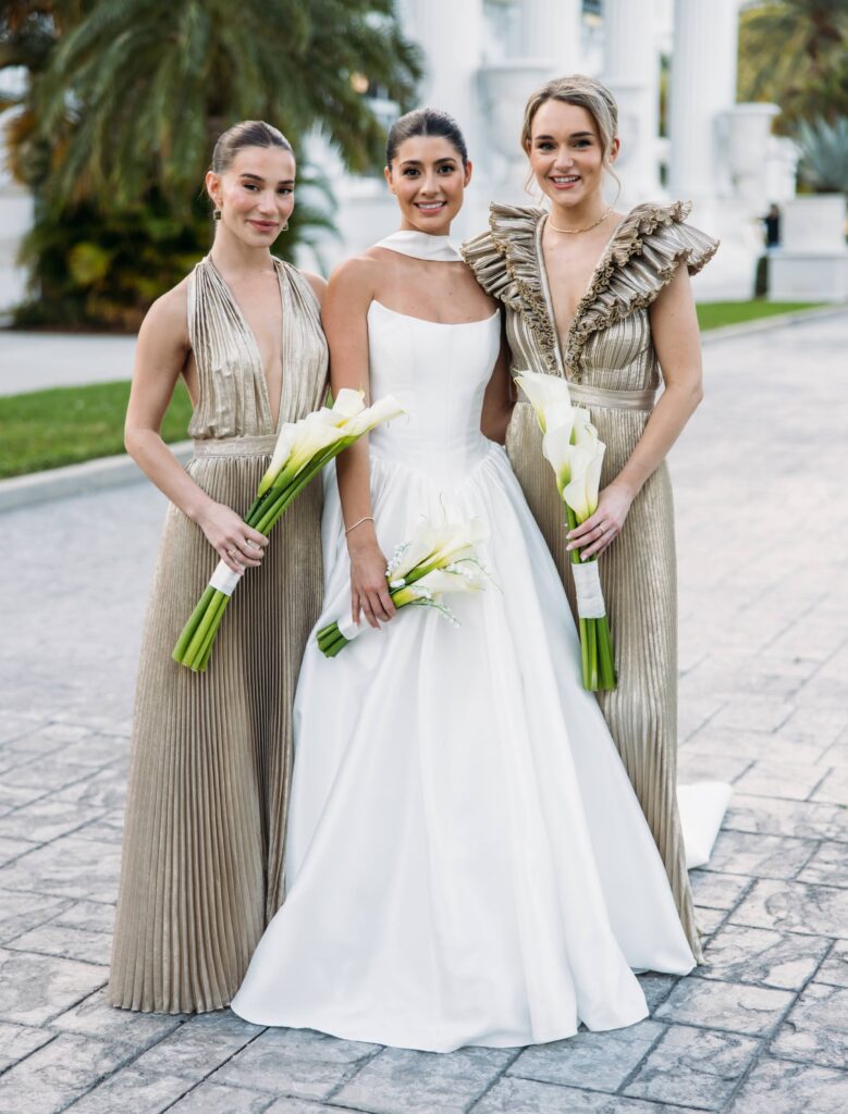 Bride with their modern all calla lily bouquets outside of the Flagler museum